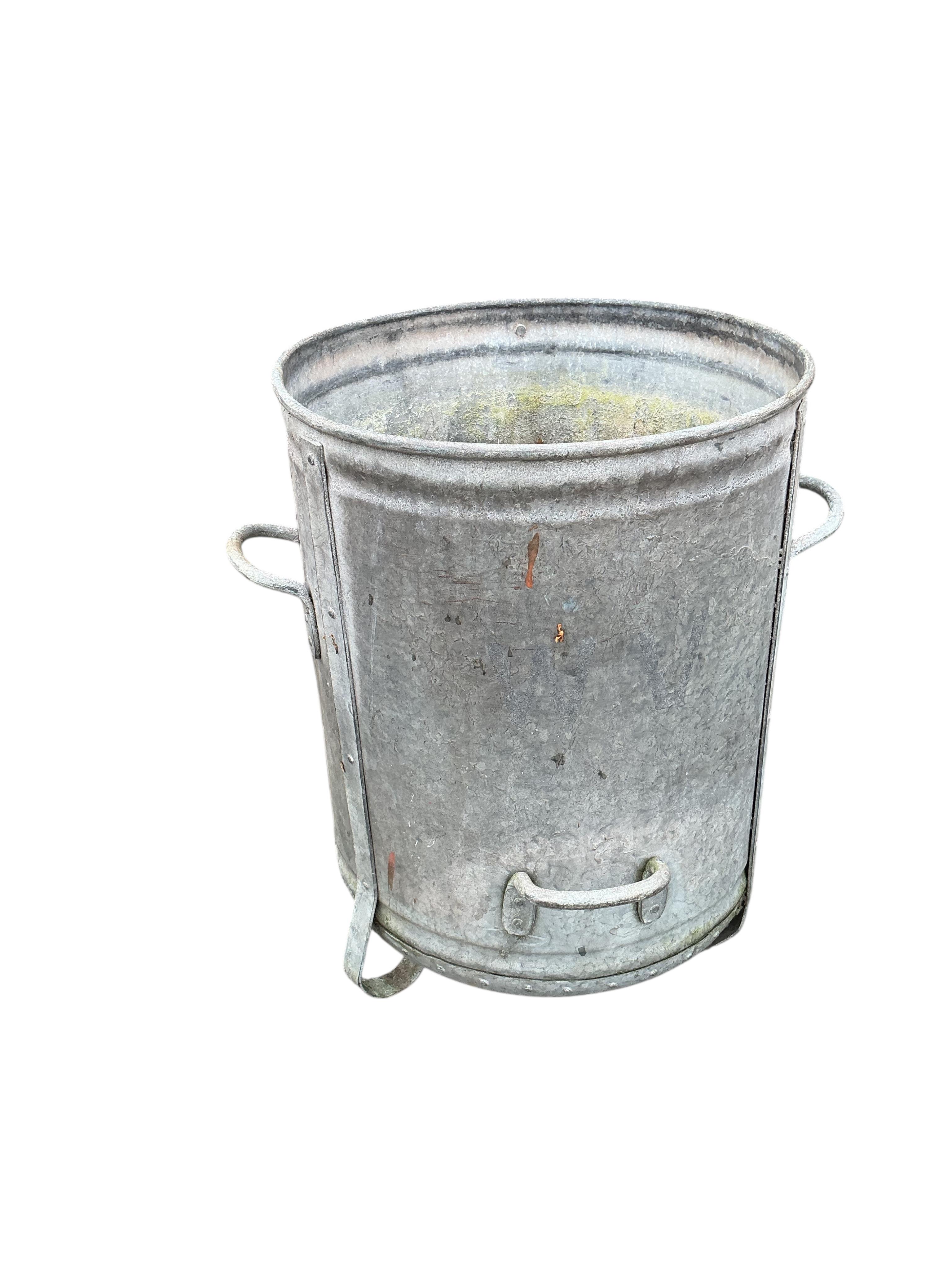 Two galvanised metal barrels, larger diameter 47cm, height 62cm